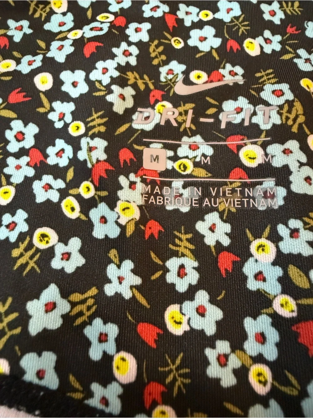 Nike Black Floral Leggings with Pink and Teal Accents